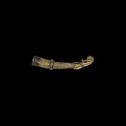 Saxon Gilt Silver Drinking Horn Terminal
6th-7th century AD. A silver-gilt drinking horn finial comprising a stylised bird-head with pellet eye and c...
