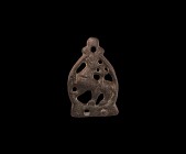 Anglo-Scandinavian Howling Beast Stirrup Mount
11th century AD. A bronze stirrup mount with openwork ovoid body and wolf in profile with head thrown ...