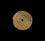 Anglo-Saxon Gold Chip-Carved Disc Brooch
5th-6th century AD. A large gilt-bronze disc brooch comprising a cha mfered outer rim, band of guilloche aro...