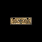 Anglo-Saxon Gilt Chip-Carved Mount
6th century AD. A substantial parcel-gilt bronze rectangular mount with central reserved lozenge and two Style I T...