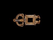 Germanic Gilt Silver Raven Heads Buckle
5th century AD. A silver-gilt 'eagle' buckle and plate comprising: a domed D-shaped loop with stepped outer e...