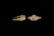 Elizabethan Gold Ring with Pyramid Diamond
16th century AD. A slender gold finger ring with scrolled detailing to the shoulders, pyramidal bezel with...