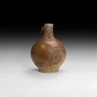 Post Medieval Bellarmine Jar
16th century AD. A salt-glazed stoneware jug of bartmannskrug type with bulbous body, broad base, ribbed collar and stra...