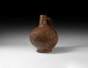 Post Medieval Bellarmine Jar with Shields
16th century AD. A salt-glazed stoneware jug of bartmannskrug type with bulbous body, flared base, ribbed c...