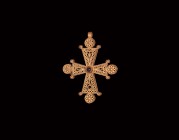 Post Medieval Gold Filigree Cross with Garnet
18th-19th century AD. A hollow gold cruciform pendant formed as panels of openwork filigree, trapezoida...