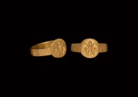Byzantine Gold Ring with Saint
6th-7th century AD. A gold finger ring with image of a saint with raised hands between fishes within a beaded border o...