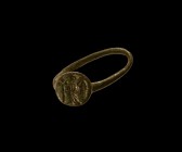 Medieval Ring with Angel
12th-14th century AD. A bronze finger ring comprising a round-section hoop and discoid bezel with intaglio winged angel hold...