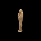 Egyptian Hieroglyphic Shabti
Late Period, 664-332 BC. A cream glazed composition shabti with mummiform shape, tripartite wig and false beard, arms cr...