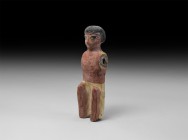 Egyptian Polychrome Boatman Figure
Middle Kingdom, 12th-11th Dynasty, 2055-1650 BC. A substantial carved wooden figurine of a squatting boatman weari...