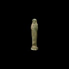 Egyptian Glazed Shabti
Late Period, 664-332 BC. A green glazed composition shabti with tripartite wig and plaited beard, crossed hands holding tools,...