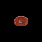 Egyptian Carnelian Scarab
New Kingdom, 1550-1070 BC. A carved red carnelian scarab with detailed carapace, plain underside, pierced longitudinally. S...