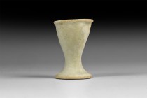 Egyptian Faience Cup
New Kingdom, 1550-1070 BC. A glazed composition cup with flared foot, rolled rim. 23.3 grams, 45mm (1 3/4"). From an early 20th ...