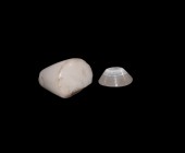 Phoenician Stamp Seal and Gemstone
6th-4th century BC. A group of two stone items comprising: a conical alabaster stamp seal with engraved image of a...