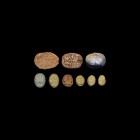 Egyptian and Other Scarab Collection
Mainly Late Period, 664-332 BC. A mixed group of glazed composition scarabs comprising: a white scarab with deta...