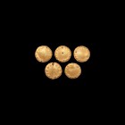 Phoenician Gold Appliqué Mount Group
6th-4th century BC. A group of gilt-bronze disc appliqués with repoussé pellets and two piercings. 10.46 grams t...