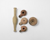 Egyptian Oil Lamp and Vessel Collection
Mainly Ptolemaic Period, 332-30 BC. A mixed group of ceramic vessels comprising: a terracotta oil lamp with r...