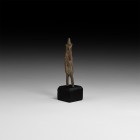 Egyptian Nefertum Figurine
Late-Ptolemaic Period, 664-30 BC. A bronze figurine of the god Nefertum, advancing wearing a conical crown over the tripar...