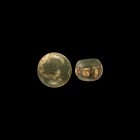 Egyptian Glass Face Bead and Gaming Counter
Roman Period, 30 BC-323 AD. A pair of glass items comprising: a plano-convex gaming counter; an annular b...