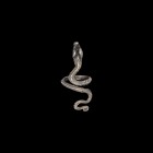 Egyptian Silver Coiled Snake Ring
Ptolemaic Period, 332-30 BC. A silver finger ring formed as a serpent, triangular-sectioned body, with curled tail ...