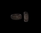 Grand Tour Ring with Hieroglyphs
19th-20th century AD. A wooden ring with wide D-section shank, oval-shaped flat bezel engraved with three hieroglyph...