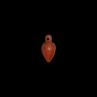 Egyptian Jasper Heart Amulet
New Kingdom, 1550-1070 BC. A carved carnelian heart (ib) amulet with pierced lug above. 0.84 grams, 14mm (1/2"). From a ...