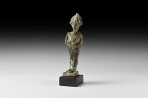 Egyptian Osiris Figurine
Late Period, 664-332 BC. A bronze figurine of the god Osiris with arms folded across the chest holding the crook and flail, ...