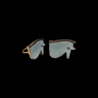 Egyptian Eye of Horus in Gold Ring
Third Intermediate Period, 1069-702 BC. A large pale blue composition wedjat amulet with applied black trail to th...