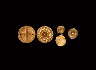 Greek Gold Appliqué Group
5th-3rd century BC. A group of five gold foil discs with repoussé pellet and line detailing; two joined by a link. 1.55 gra...