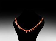 Greek Carnelian Bead Necklace String
2nd-3rd century AD. A restrung necklace of graduated carnelian oblate beads with crescent-shaped and tooth-shape...