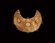 Greek Gold Lunar Pendant
5th-3rd century BC. A sheet-gold crescent pendant with repoussé points to the border, applied loops to the rim, cells to the...
