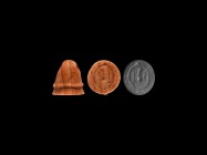 Greek Gnostic Stamp Seal
4th-7th century AD. A carved jasper stamp seal with pierced dome, raised collar and face with intaglio design of a disc and ...
