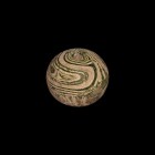 Greek Marbled Glass Bead
5th-3rd century BC. A substantial spherical polychrome glass bead with swirled trails. 24.43 grams, 28mm (1"). From the priv...