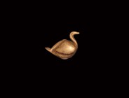 Greek Hellenistic Gold Dove Amulet
4th-3rd century BC. A hollow-formed gold amulet in the shape of a reclining bird with short tail and incised wings...