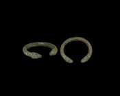 Greek Ram-Headed Bracelet
4th-2nd century BC. A heavy bronze bracelet with round-section shank, terminals formed as two opposing ram's heads with cur...