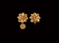 Greek Gold Flower Pendant Pair
5th-3rd century BC. A pair of gold flower pendants, each with eight petals and a central loop to the reverse, circular...