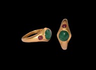 Greek Hellenistic Gold Ring with Emerald and Garnets
2nd-1st century BC. A gold ring with substantial D-section hoop, flared bezel with inset emerald...