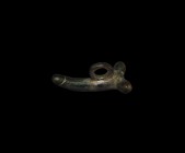 Roman Phallic Pendant
1st-2nd century AD. An elongated bronze phallic pendant with large suspension loop above. 22.9 grams, 45mm (1 3/4"). Property o...