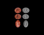 Roman Figural Gemstone Collection
1st century BC-2nd century AD. A mixed group of two carnelian and one red jasper intaglios comprising: one with tro...
