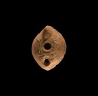 Roman Oil Lamp with Huntsman
5th-6th century AD. A greyware ceramic oil lamp with pellets to the underside, broad body with lateral cusp, discus with...