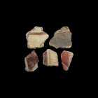 Roman Polychrome Fresco Fragment Group
1st century AD. A group of well preserved thick coarse white wall plaster fragments from a fresco with painted...