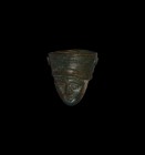 Roman Janus Head Finial
1st-2nd century AD. A bronze conical-shaped finial depicting two similar heads of a young male wearing a helmet, concentric c...