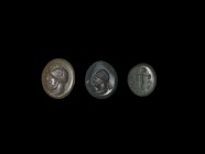 Roman Intaglio Gemstone Group
1st-2nd century AD. A group of three glass intaglios comprising two with engraved diademed male profile busts, one of a...