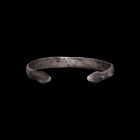 Roman Silver Snake Bracelet
1st-2nd century AD. A silver flat-section bracelet with slightly raised median band, the terminals depicting snake heads ...