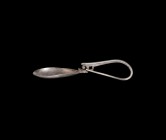 Roman Silver Swan-Necked Spoon
3rd-4th century AD. A silver cochlearia spoon with shallow piriform bowl, swan-neck junction with void, spike handle. ...