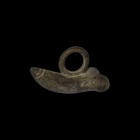 Roman Phallic Pendant
1st-2nd century AD. A bronze phallic pendant with incised detailing to the tip, large suspension loop to the upper face. 21.1 g...