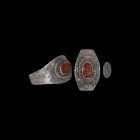 Roman Ceres Gemstone in Silver Ring
1st-2nd century AD. An oval carnelian intaglio engraved with standing Ceres (Greek Demeter), holding a cornucopia...