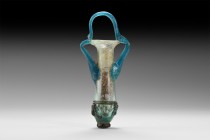Roman Glass Amphoriskos
1st century AD. A glass amphoriskos with iridescent tapering body and everted mouth, rolled rim, applied blue glass angled ha...