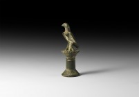 Roman Standing Eagle
1st-2nd century AD. A bronze figure of a standing eagle on top of a pillar, head turned to the right and wings slightly extended...