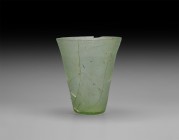 Roman Glass Beaker
3rd century AD. An aqua glass beaker with pontil base and tapering body. Cf. Whitehouse, D. Roman Glass in the Corning Museum of G...