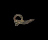 Roman Phallic Pendant
1st-2nd century AD. A bronze phallic pendant with elongated glans, large suspension loop above, 11.5 grams, 33mm (1 1/4"). Prop...